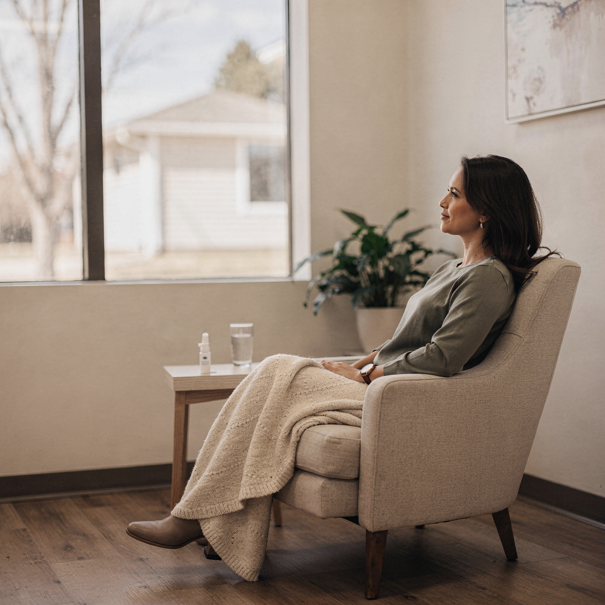 Patient relaxing in a comfortable chair during Spravato treatment at Neowellnez's Olathe office